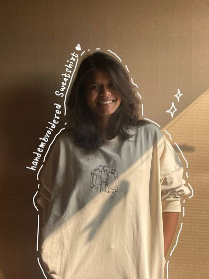 A full look at the custom line art sweatshirt. It's a simple design on the chest, but it holds so much meaning for the person wearing it.