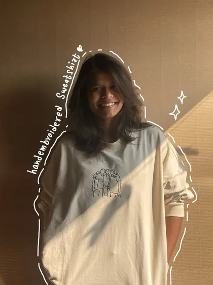 A full look at the custom line art sweatshirt. It's a simple design on the chest, but it holds so much meaning for the person wearing it.