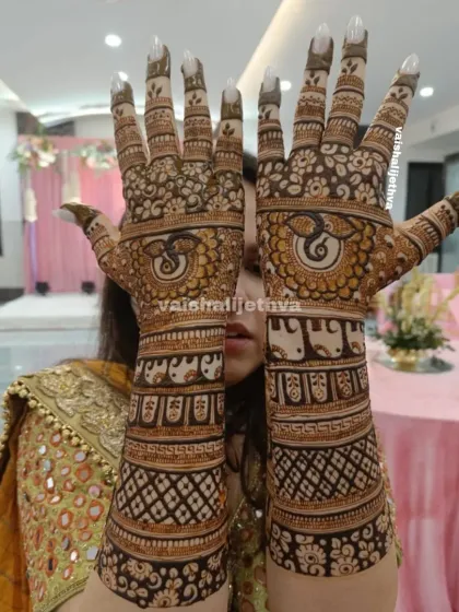 A stunning back-hand design featuring Ganesha and elephant motifs. The intricate patterns and bold figures create a divine and majestic look.