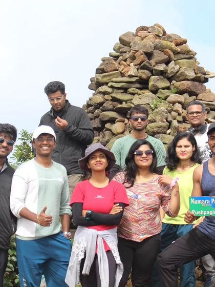 A fun group photo at the peak. The sense of achievement and camaraderie is high after completing the Kumaraparvatha trek.