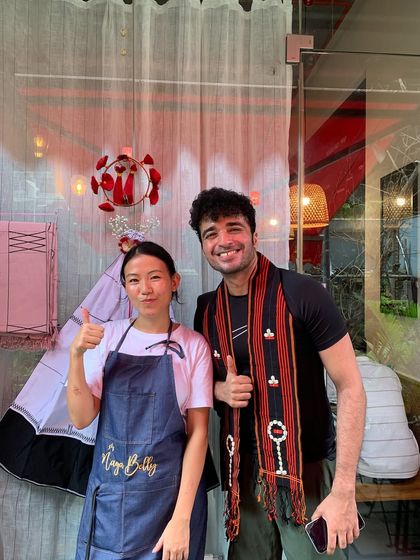 One of our team members with a happy guest during the Tuluni festival. The thumbs-up says it all!