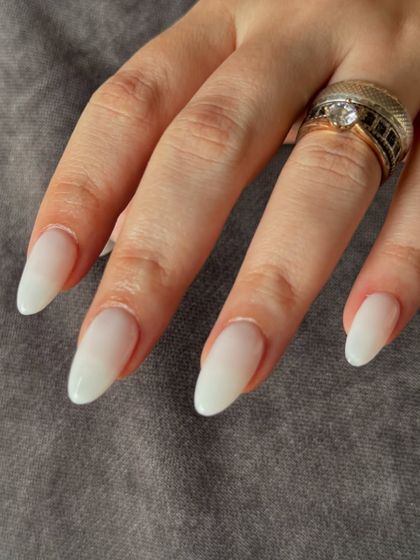 A close-up showing the soft, semi-sheer finish of these milky white extensions.