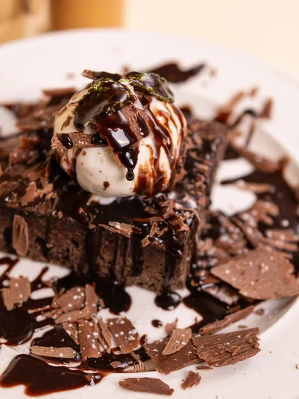 For the ultimate chocolate lover, our rich, fudgy brownie with a scoop of vanilla ice cream and chocolate shavings is pure heaven.