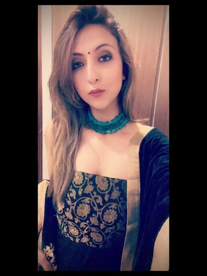 A close-up of my festive look. The green beaded choker contrasts beautifully with the blue and gold of the anarkali.