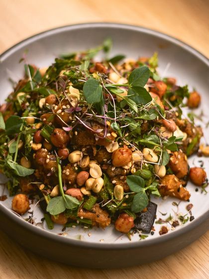 The perfect salad does exist. Our Asian Peanut Salad features roasted pumpkin, broccoli, kale, and a crunchy peanut topping, all tied together with a miso-ginger dressing.