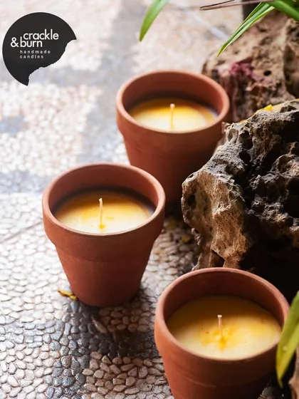 These terracotta pot candles are another great option for your balcony or garden. They have a rustic charm and are infused with a refreshing citrus scent.