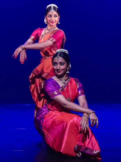 This photo captures the conversational aspect of a duet, where two dancers interact and respond to each other through movement and expression.