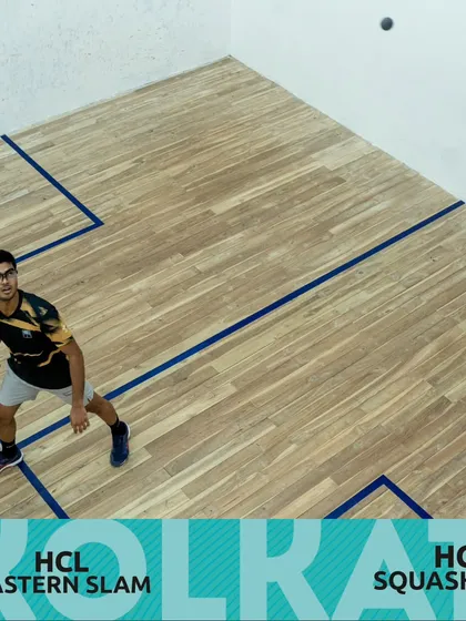 A player in position, ready to return a tough shot during the HCL Squash Tour. Agility and court coverage are key parts of our training.