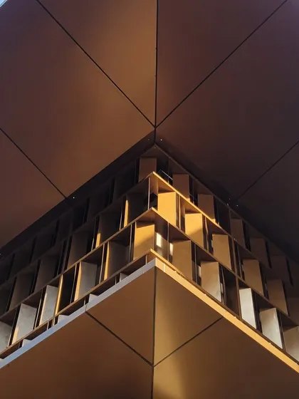 A close-up of a parametric jaali. This screen isn’t just for aesthetics; it’s data-driven design. Each module is shaped by sun path analysis to optimize shade and visual permeability, creating a rhythmic and responsive facade.