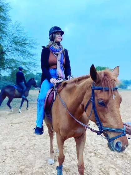 A casual rider enjoying a lesson in our arena. It doesn't matter if you've never touched a horse before; I am here to guide you at your own pace.