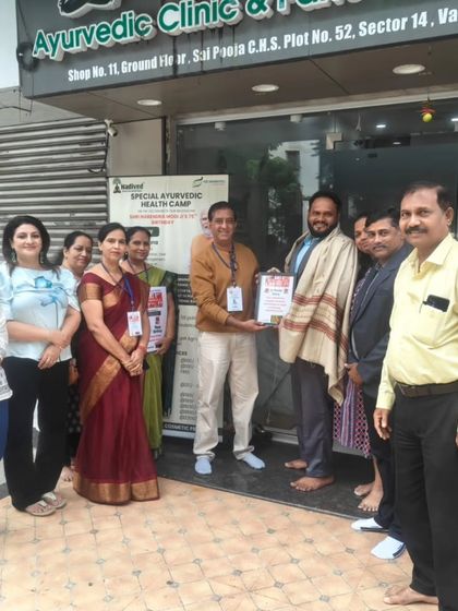 A group photo with the team and dignitaries at the health camp. It takes a collective effort to organize such events and spread awareness about holistic health.