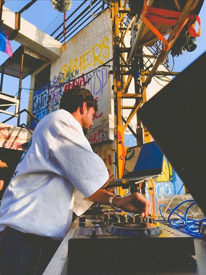 Another angle from the decks in Ahmedabad. The graffiti and industrial setup gave the party a raw, underground feel.
