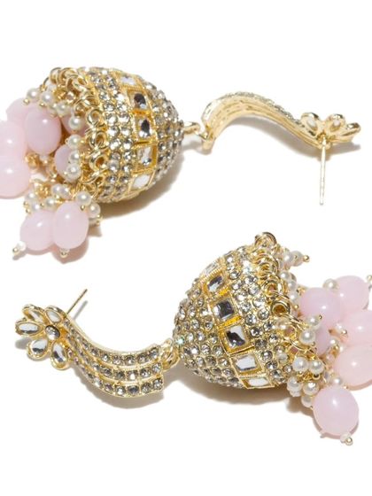 A closer look at the pink version of our large kundan jhumkas. The soft pink beads add a feminine touch to the bold design.