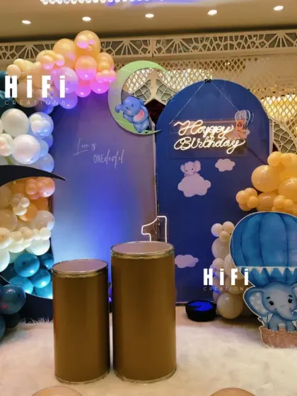 Another angle of the dreamy moon and hot air balloon birthday theme, showcasing the custom backdrop and balloon clouds.