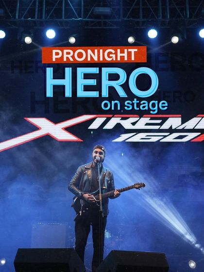 We ensure our brand partners get prime visibility. Here, the Hero Xtreme 160R logo is featured prominently on stage during a headline performance at a campus festival we produced.