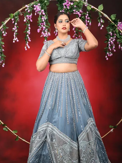 A powerful and elegant pose. The makeup is designed to be photogenic and make a statement.