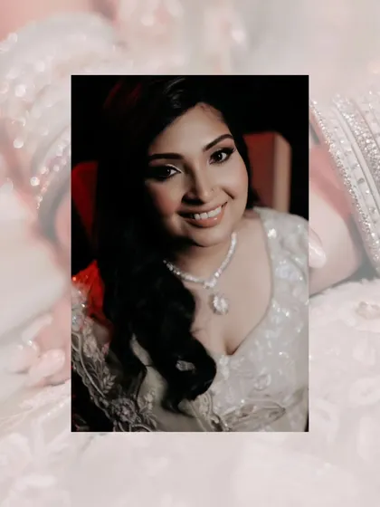 A close-up portrait of Shalini, her radiant smile and sparkling necklace capturing the joy of her engagement day.