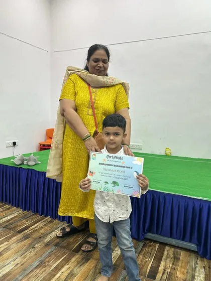 This young performer proudly displays his certificate with his mother after our 'Commotion in the Ocean' showcase. These moments of recognition are so important for building self-esteem.