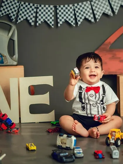 Celebrating one year with all his favorite toys. This little mechanic is surrounded by cars, making his first birthday session extra special.