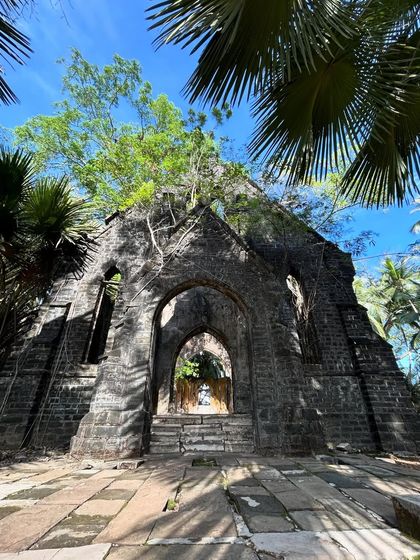 The ruins of an old church on Ross Island, Andaman. Nature has taken over these British-era structures, creating a unique and hauntingly beautiful landscape.