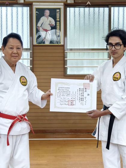 Senpai Pranav S V receiving his Nidan (2nd Dan) certificate from Hanshi Minoru Nakazato. A significant milestone achieved at the home of karate.