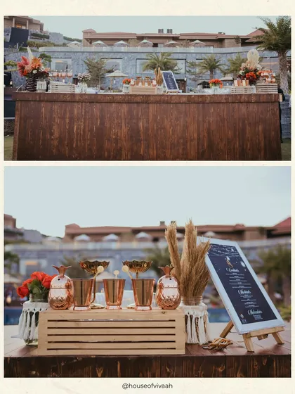 A split view of the rustic wooden bar and pineapple-shaped copper mugs, highlighting the unique and thematic details of the "Mystic Mehendi" celebration.