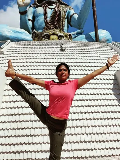 A moment of devotion in front of a magnificent Shiva statue in Nepal. This standing leg extension, Utthita Hasta Padangusthasana, is an offering of my practice.