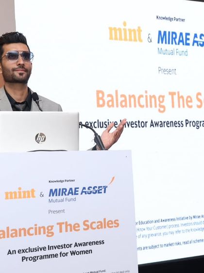 Using expressive gestures to emphasize a point during the financial awareness program. My dynamic presentation style helps keep the audience captivated throughout the event.