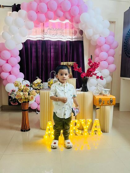 My son Atharva posing in front of his sister's birthday setup. He was so excited for the party.