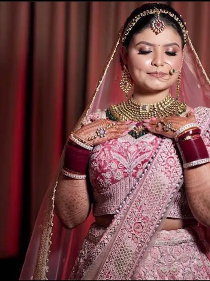 A moment of quiet grace, with the bride looking down, her hands gently resting on her chest.