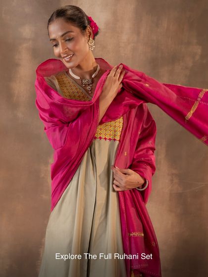 Explore the complete Ruhani set, a perfect ensemble for any celebration. The flowing A-line kurta, paired with a brilliant pink dupatta, creates a look of effortless grace and movement.