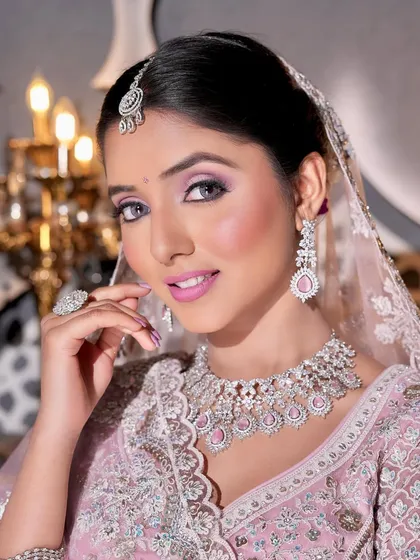 A close-up that radiates pure glamour. The shimmering eyeshadow, perfectly flushed cheeks, and pink lips create a look that is both beautiful and memorable.