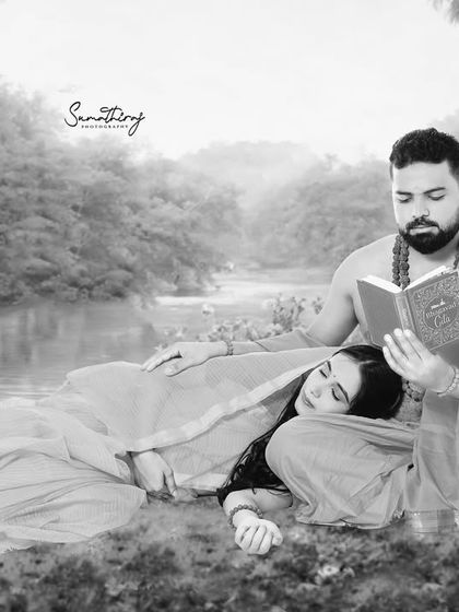 A serene moment from the Ram-Sita inspired shoot, captured in black and white. The husband reads to his wife as she rests, creating a peaceful and intimate portrait that transcends time.