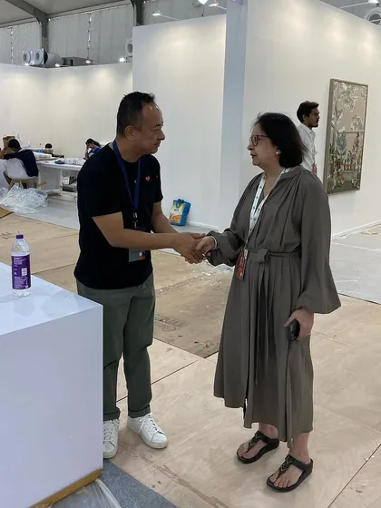 Artist Tsherin Sherpa visiting our booth during the setup for Art Mumbai and meeting with our director.