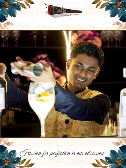 A happy bartender shakes up a cocktail, embodying the energy and passion we bring to every event.