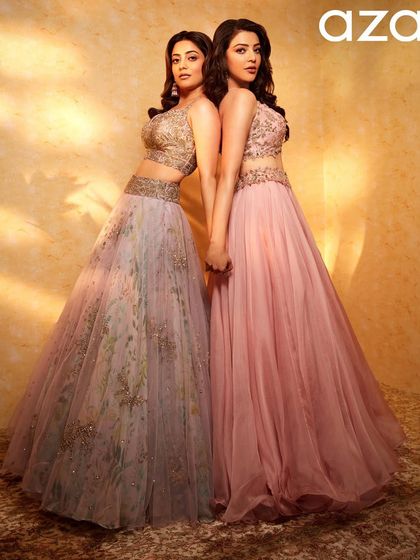 A classic sister pose for Aza Fashions. The coordinated hairstyles and pastel outfits create a beautifully harmonious and elegant image.