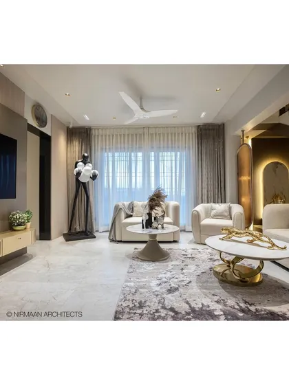 A look inside our Duplex Project, where luxury is in the details. This living room combines plush seating, dramatic lighting on the staircase, and a sophisticated color palette to create a space that is both grand and inviting, perfect for a modern family lifestyle.
