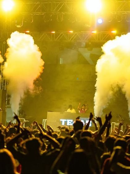 The stage at IIM Indore, lit up with smoke cannons and bright lights. This is the full-scale production I bring to every college festival.