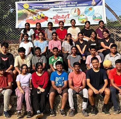 A group photo of participants from the Dandeli rafting and kayaking course, celebrating the completion of their camp.