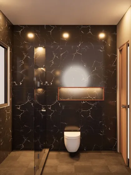 A bathroom we delivered in GK-1, South Delhi, featuring dramatic black marble-look tiles. The built-in niche with accent lighting adds both functionality and a touch of luxury.