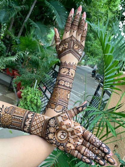 Another angle of this stunning engagement mehndi, showing the clean lines and symmetrical patterns that extend up the arm.