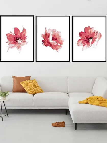 This set of three framed prints features beautiful, abstract red rose flowers. The minimalist presentation on a clean white background makes the vibrant color pop, creating a modern and romantic floral display.