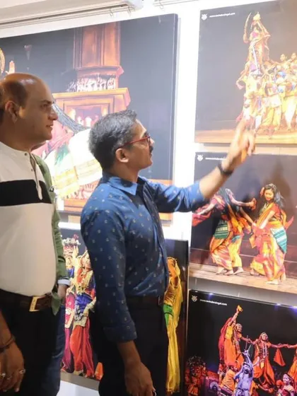 Dr. Ravindra Singhal explaining the story behind one of his stunning cultural photographs to me.