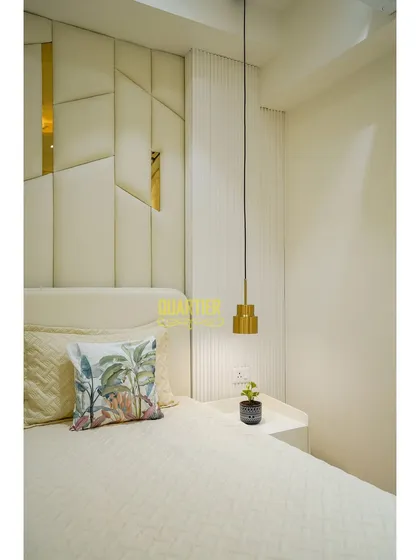 Another detail shot of the Tata LaVida master bedroom, focusing on the pendant light and the texture of the fluted wall panel next to the bed. Every element is chosen to contribute to a serene atmosphere.