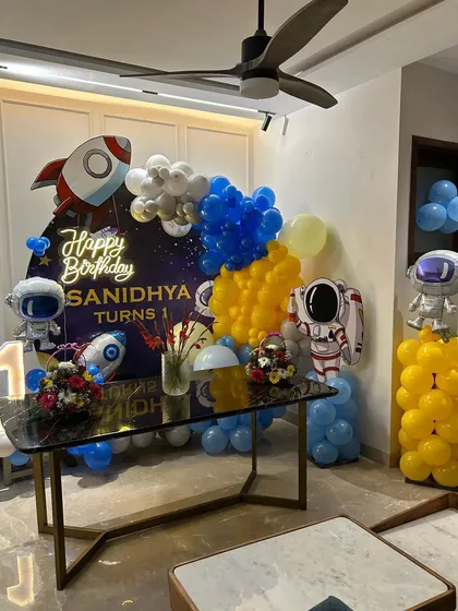 This wide shot shows how the entire space-themed decoration comes together in a living room.