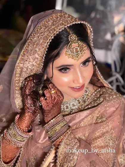 A happy, candid moment. The makeup is designed to look beautiful even when she's smiling and laughing.