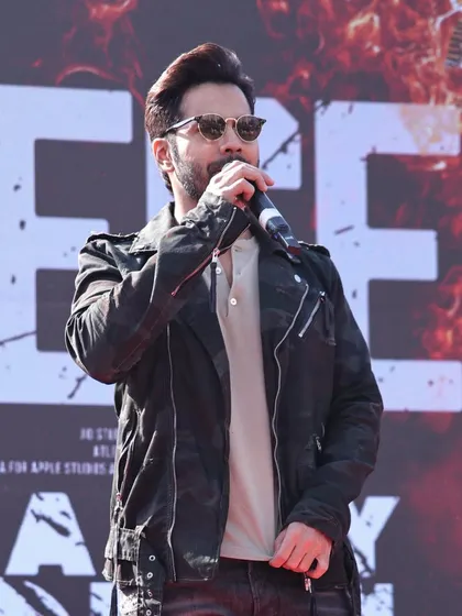 Varun Dhawan addressing the audience during the 'Baby John' promotional tour. We ensure the technical setup, including audio and stage design, is flawless for celebrity addresses, press conferences, and fan interactions.