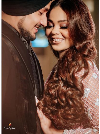 A happy, candid moment between Avni and Maninder. Their genuine smiles and easy chemistry are what we strive to capture in our couple portraits.