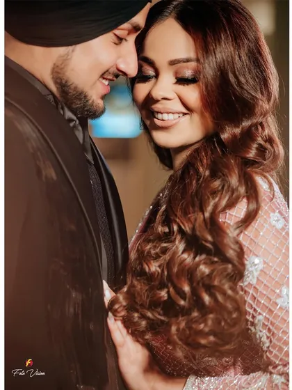 A happy, candid moment between Avni and Maninder. Their genuine smiles and easy chemistry are what we strive to capture in our couple portraits.