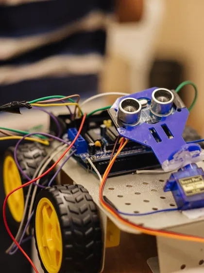 A close-up of a finished robotic car, featuring an ultrasonic sensor. This showcases the complexity and functionality of the projects our students build.